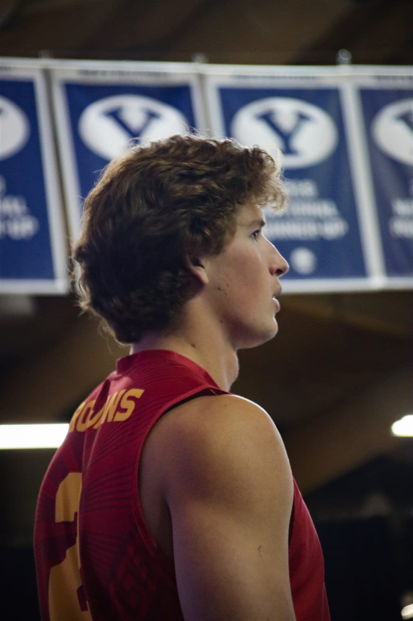 A USC volleyball player under the banners at BYU